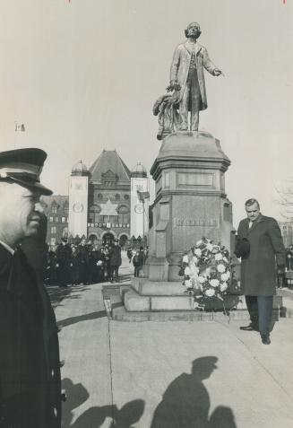 A birthday shared, On his 50th birthday, Premier John Robarts places a wreath at the University Ave, statue of Sir John A. Macdonald, who was born 152 years ago