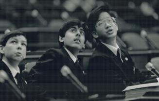 From left, Legislative Pages Neil Buie, Nawaz Tahir and Stephen Cho await a call to action