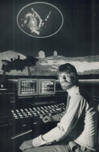 Star show: John Kenny, above, works the control console in the planetarium's theatre