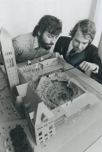 Looking Over a Model of their conception of a concert hall to replace aging Massey Hall as the home the Toronto Symphony, planning consultant Tupper F(...)