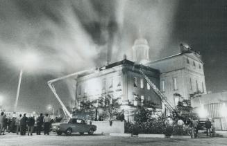 Smoke Billows from St. Lawrence Hall last night while firemen fight a blaze that broke out in the attic, drove more than 300 people out of the buildin(...)