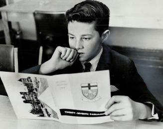 Studying the program is Patrick Hutchison, one of the 14-boy corps of pages which will serve MPPs during the current session. The boys get $5 a day, g(...)