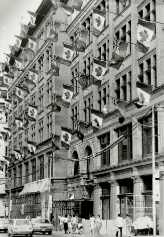 Canadian flags adorn facade of Simpsons Ltd