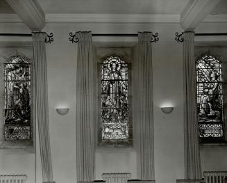 On the south side the three stained-glass windows represent the Saviour in His earthly ministry