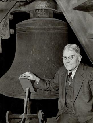Mr. Lye beside one of the huge bells in the tower of St. James' cathedral