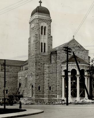 Image shows a view of the church building from the intersection side.