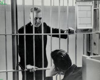 Brigadier Cyril Everitt of the Salvation Army counsels a youthful prisoner in the Don jail