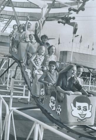 CNE opens - and the good times roll again, The magic, magnetic midway and its mini-roller coaster ride were the first order of business for these chil(...)