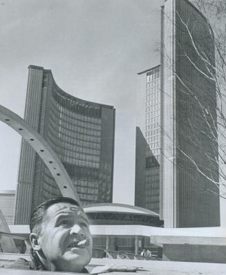 Up he popped - and down it dropped, A cigar clenched in his teeth, Don Searway pops his head out from beneath Nathan Phillips Square in time to see th(...)