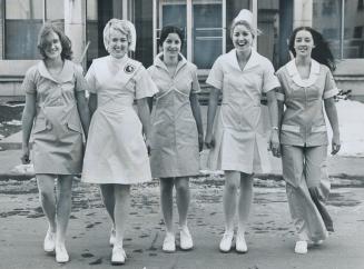 One of these five uniforms will be chosen on Monday as the official one for the nursing division of George Brown College. Modelling uniforms are nursi(...)