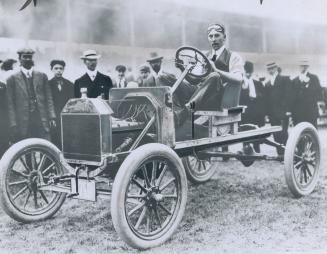 Early model auto is shown at the EX in 1911 when it was regarded as the very latest thing in horseless carriages