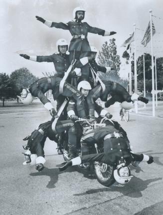As easy as falling off a log or so it seems to these daredevil motorcycle riders, members of the White Helmets motorcycle stunt team of the Royal Army(...)