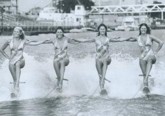 It's a sister act at the ex, Smiling, the clarke sisters from Orillia skim on skis during the aquarama at the Canadian National Exhibition yesterday: (...)