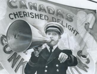 Ross Skene, one of the carnival barkers at the Conklin Shows 1928 midway, ropes in the rubes with his megaphone and brass-buttoned uniform reminiscent(...)