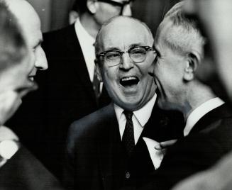 W. W. Gardhouse (left) with Metro Chairman Bill Allen, Metro's first clerk laughs over old times with his former chief
