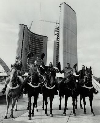 Horsing around at City Hall, A western view of the new city hall is obtained when rider from the Canadian Championship Rodeo at Maple Leaf Gardens pony up for a look-see