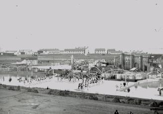 With the old fort in the background, this was the grandstand scene during the spectacle of 1896 which was of a patriotic nature and ended as before and ever since in a big display of fireworks