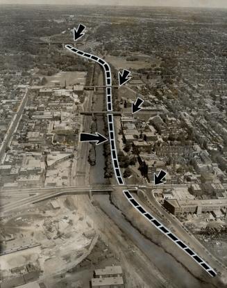 Proposed route of Don Valley roadway to drain traffic load from overcrowded north-south arteries, is shown by heavy dotted line on this aerial view of(...)