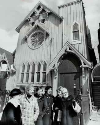 Members of the Heliconian Club standing in front of the little wooden church are from the left, Marguerite Craigie, Marguerite DeJardin, Erma Sutcliff(...)