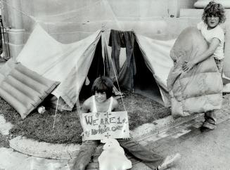 And only two more weeks to go, The tent may sag and they've had some rain, but Stephen Cox (right) and Alex McAuley, both 13, together with two other (...)