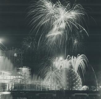 Spectacular fireworks display lights the sky above the glittering, ball-shaped Cinesphere to wind up the opening day festivities at Ontario Place Satu(...)