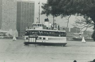 A jam-packed ferry leaves the Toronto docks for the Islands where an estimated 23,000 took refuge from the heat yesterday