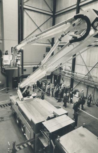 First-hand look: An inquest jury, coroner and six lawyers watch a cherry picker demonstration at the fire department training centre yesterday