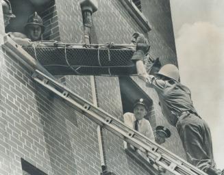 Fire Captain Jack Wright (bottom, left) watches rescue training operation, some recruits do panic when confronted by fire at its hottest and deadliest, he says
