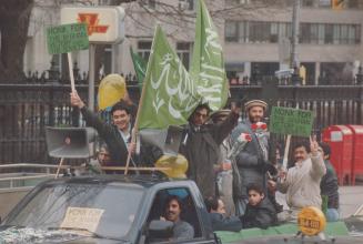 Metro Afghans mark the withdrawal of Soviet troops from their homeland with a parade of cars on Univeristy Ave