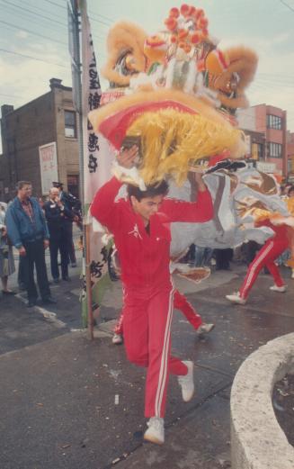 Bank opens in Chinatown, The ceremonial dance of the dragon is performed in Chinatown yesterday to mark the opening of a branch of the Canadian Imperial Bank of Commerce on Dundas St
