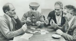 Briscola, an Italian card game, is popular with many of the pensioners who drop in at the North York branch of COSTI, the Italian immigrant-aid agency(...)