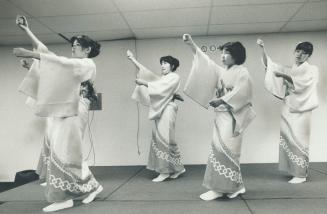 Girls perform the classical odori, a posture dance, at Touch of Japan Exhibition