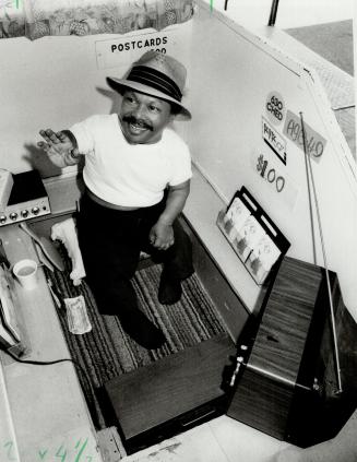 Small world: Eddie Taylor works a CNE sideshow as the world's smallest man but says his main career is nightclub singing