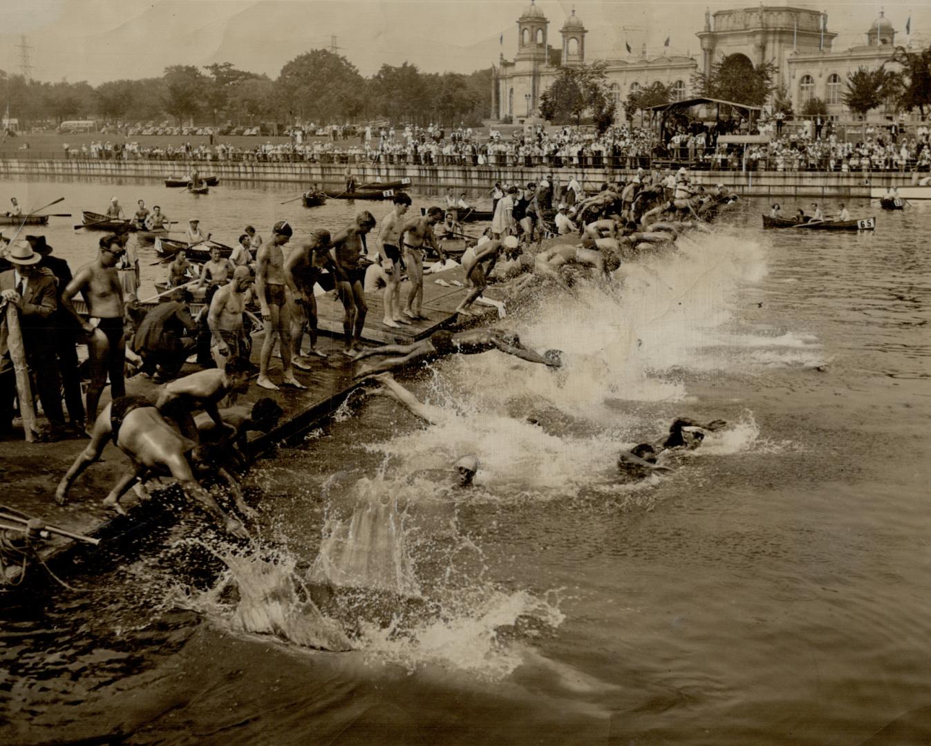 All in at once for big C.N.E. Swim, Splash, and 80 men plunge for the 10-mile marathon swim at Ex - $ 350 has brought entries from all over the continent, hibition Park to-day