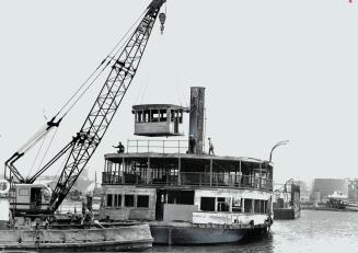 A wheelhouse is lifted off the 64-year-old steam paddle-wheel ferry Trillium by a huge crane in the Whitby yard of McNamara Marine Ltd., where a $950,(...)