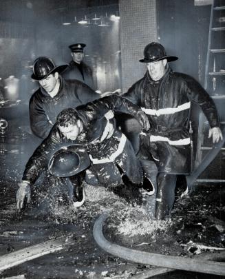 Best picture of the year picked by Toronto Firefighters' Association was this one by Toronto Star's Reg Innell, showing Jimmy Street and Harold Osborn(...)