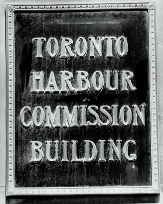 Image shows a sign that reads Toronto Harbour Commission Building.