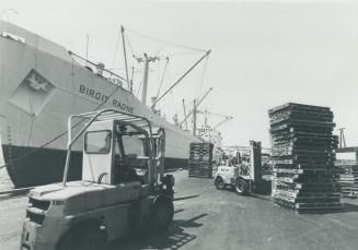 Image shows a loading in progress with the ship at the Harbour.