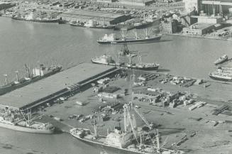 Image shows an aerial view on the Harbour with a lot of docked ships.