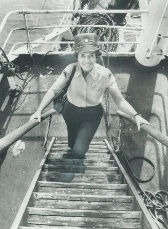 Image shows a lady climbing up the stairs on the deck.