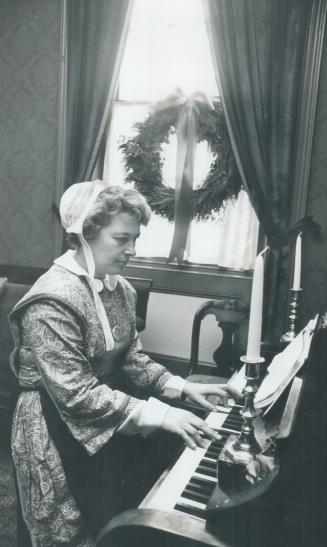 Christmas Carols are played on the organ in Mackenzie House by Pat Lochhead