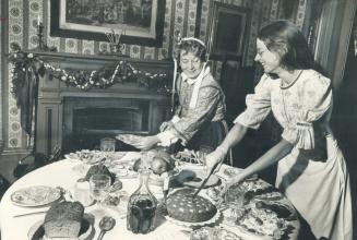 At the groaning board in Mackenzie House this week, Jenny Bull, right, and Pat Lochhead lay out a Christmas repast