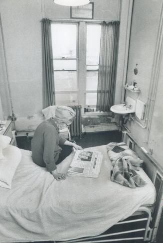 In a drab room at Lambert Lodge, a home for the aged that now is owned by Metro, Rose Sherman sits on the bed to read