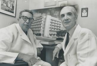 Their $40,000,000 dream hospital, shown in the photo behind them, will soon be a reality for brothers Dr. John Rekai (left) and Dr. Paul Rekai. Their (...)