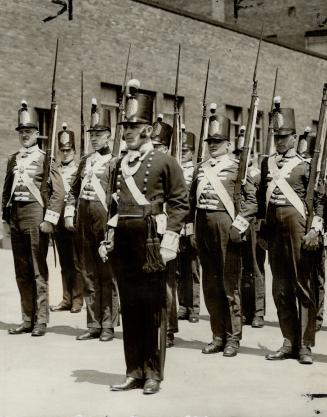 A detachment in uniforms of the 3rd York Regiment, which fought in the war of 1812, is seen shouldering arms