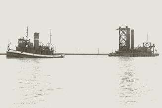 Image shows a tugboat and a workboat on the lake.