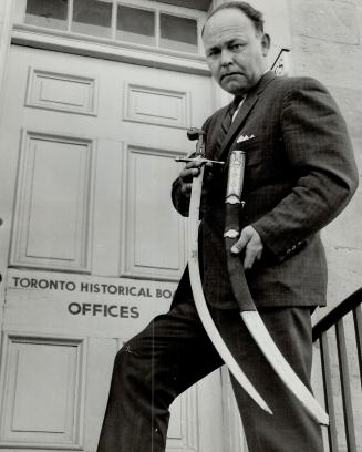 Capt. V. N. Peter Styrmo. With Simcoe's sword found in High Park