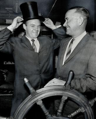 Image shows two gentlemen on the ship.