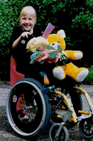 Ready to roll. Michelle Kungi, a patient at Bloorview Childrens Hospital, and her stuffed animals prepare for a day of tree and flower plating on the (...)