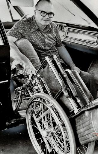 William Callow, the City of Toronto solicitor who recently lost the use of his legs, gets from his wheelchair into a car without help, as a result of intensive therapy